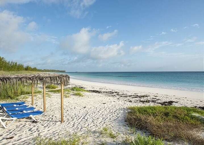 Covered lounge chairs on the beach