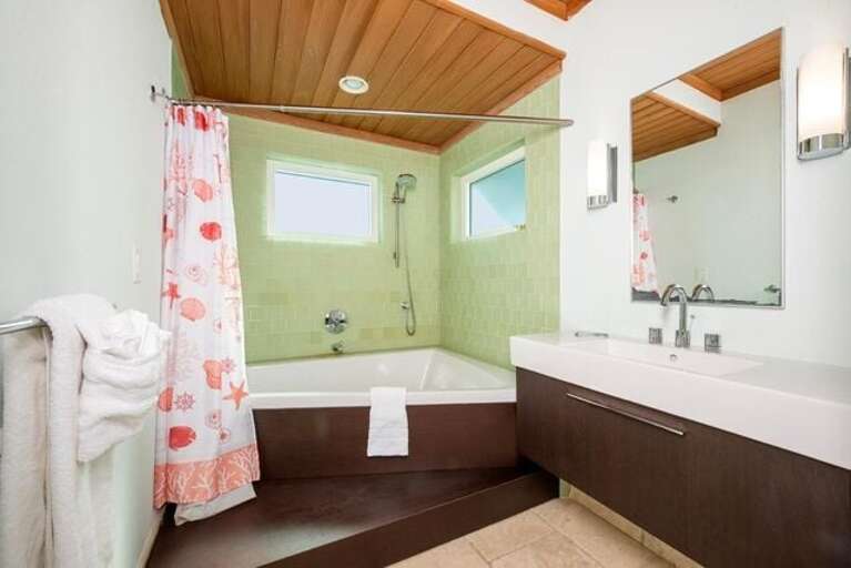 Bath with tub and shower.