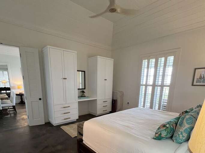 First ocean-view master bedroom with king bed and en suite bath