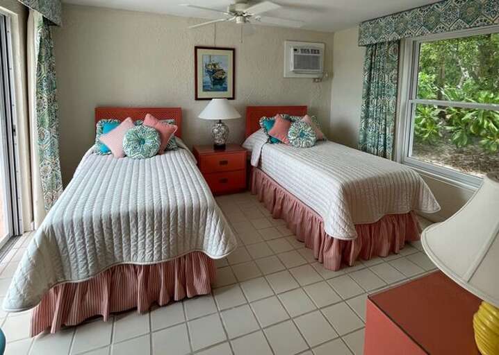 The guest bedroom has twin beds that can be configured as a king