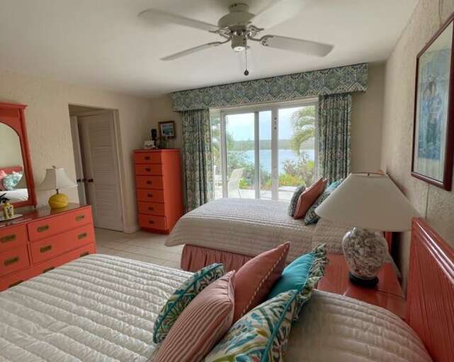 It has sliding glass doors opening onto a patio that overlooks Savannah Sound and the backyard.