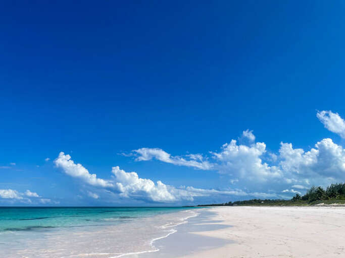 Windermere island has a world-class 3-mile-long pink sand beach that is wide, flat, and well protected by a barrier reef.