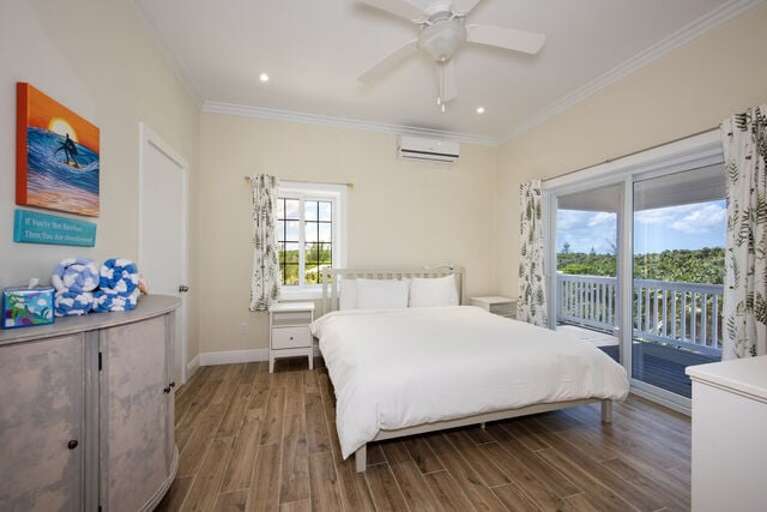 The bedroom features a king bed, walk in closet and a full en-suite bath with a walk-in shower.