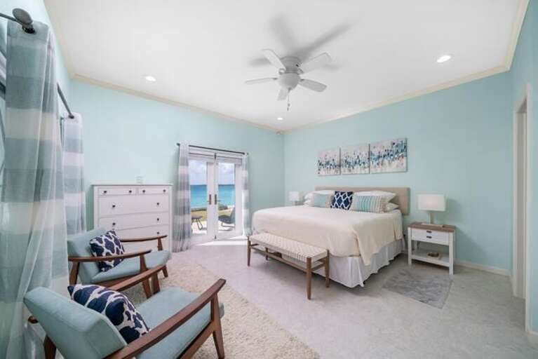 Master bedroom with king bed, ocean view, and en-suite full bath.  Master closet has a safe with a programmable code.