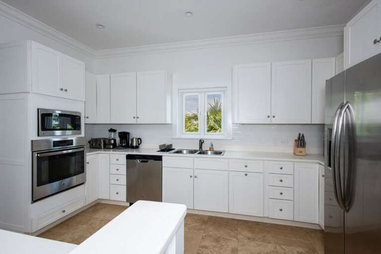 Fully equipped kitchen with stainless steel appliances.