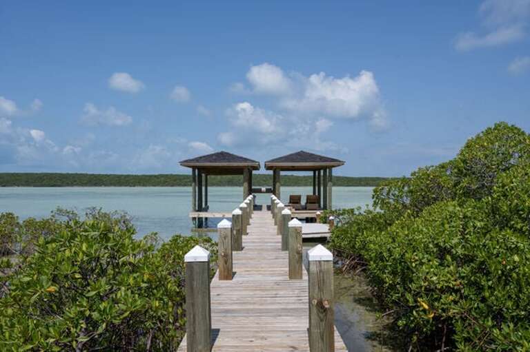 Turtle Pointe's private boat dock on Savannah Sound. This area is teeming with sea life and offers great snorkeling, kayaking, and paddle boarding. Kayak and paddleboard included!