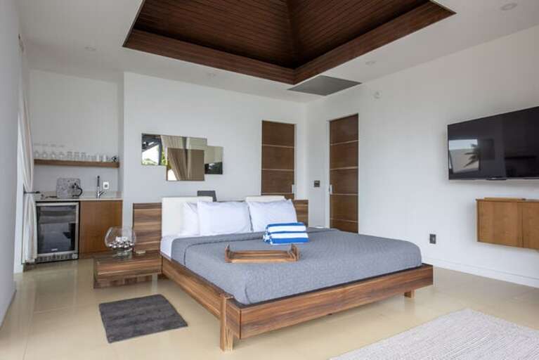 They feature fully retractable glass curtain walls with sweeping views of the ocean.