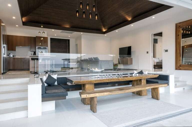 The living room and kitchen have a magnificent 25-foot vaulted Balinese ceiling.