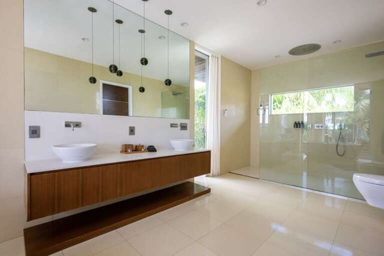A ultra-luxury master bath with Caesar stone walls and floors, top of the line luxury Hansgrohe Axor fixtures, and solid marble stand-alone tubs.