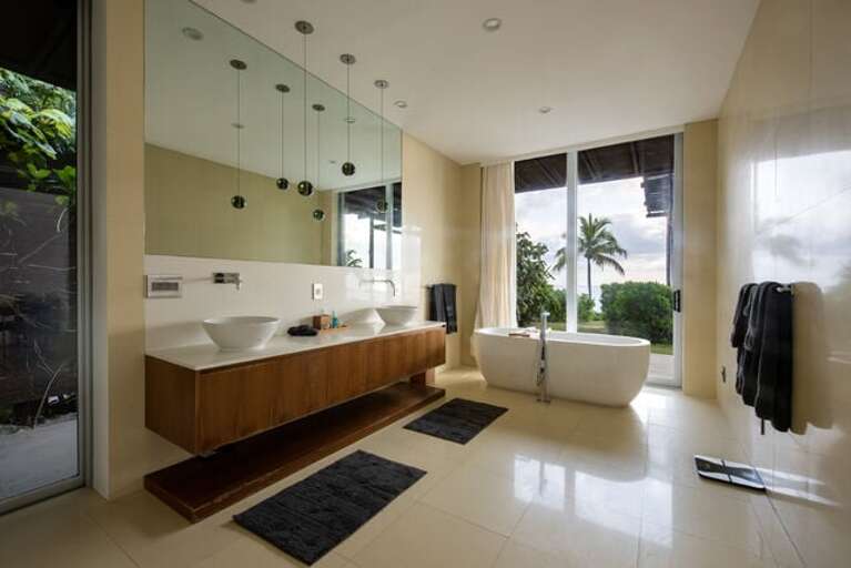 A ultra-luxury master bath with Caesar stone walls and floors, top of the line luxury Hansgrohe Axor fixtures, and solid marble stand-alone tubs.