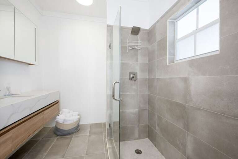 Bath with walk-in shower. Bath with walk-in shower.