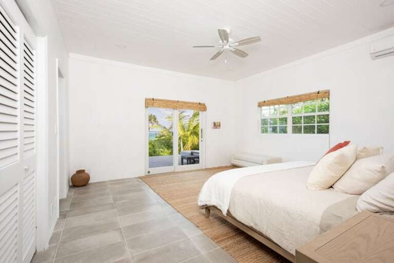 Bedroom Two with king bed, ocean view, en-suite bath, and sliding doors to patio. Bedroom Two with king bed, ocean view, en-suite bath, and sliding doors to patio.