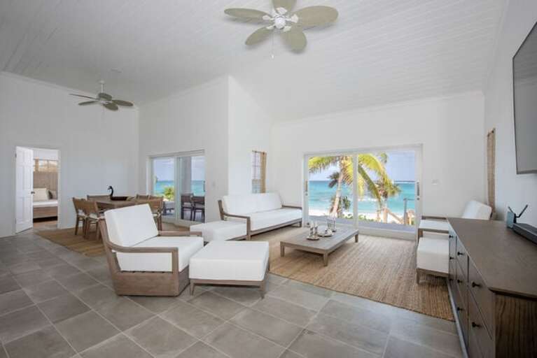Open-concept great room with large sliding glass doors providing views of the ocean.