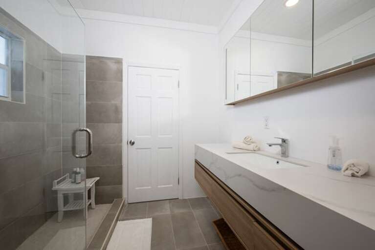 Shared bath with walk-in shower. Shared bath with walk-in shower.