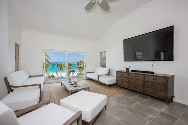 Our spectacular open-concept great room with large sliding glass doors providing views of the ocean. Our spectacular open-concept great room with large sliding glass doors providing views of the ocean.