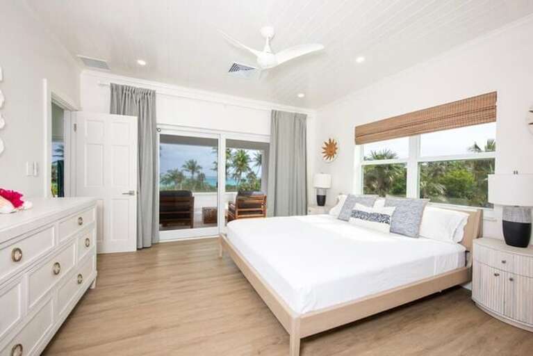 Master Bedroom with King bed, beautiful en-suite bathroom featuring walk-in showers.