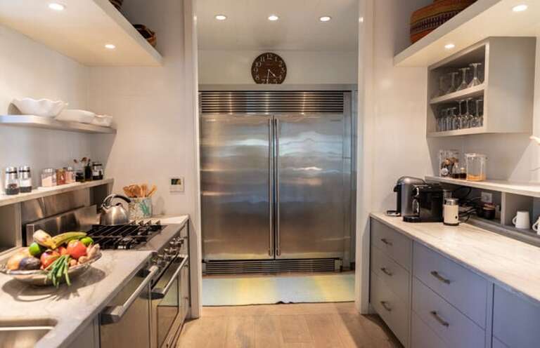 The magnificent chef's kitchen, luxuriously finished in granite and stainless steel