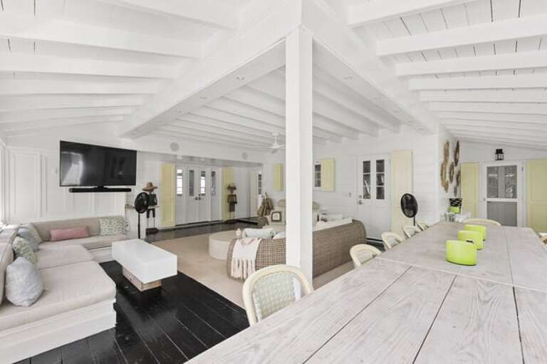 The outdoor area is the gathering place for afternoon lunch with an outdoor kitchen and 14-person dining table.