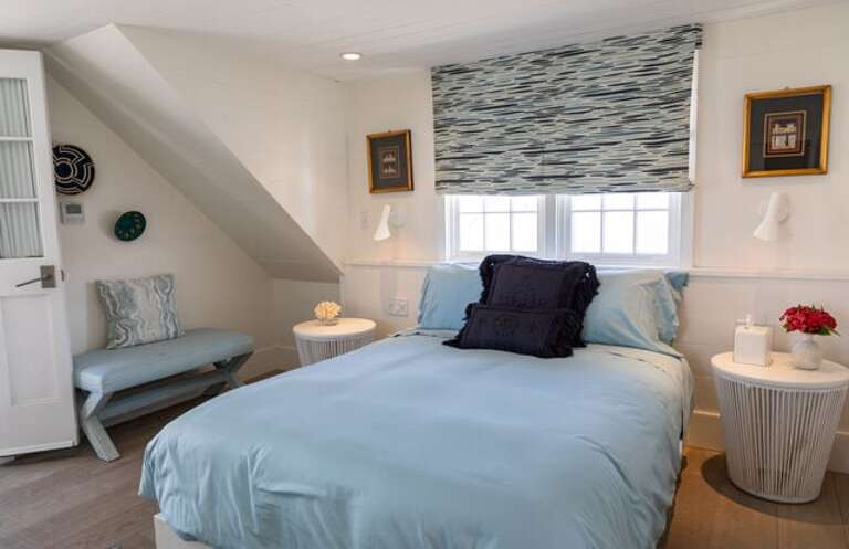 Second upstairs bedroom with queen bed, en-suite bathroom and private balcony.