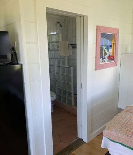 Bath with walk-in shower. Bath with walk-in shower.