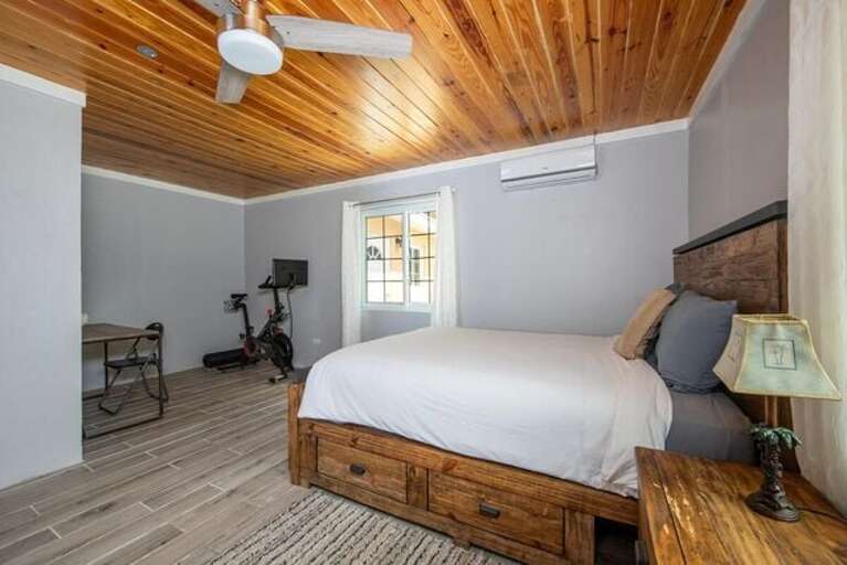 Bedroom number 2 with queen bed, en-suite bath, and a Peleton!