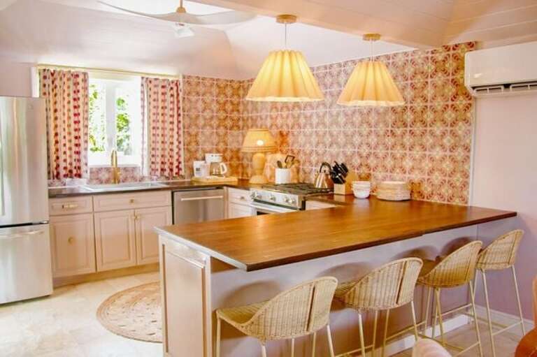 Modern appliances including refrigerator with freezer, gas stove, oven, wine cooler, beverage cooler, dishwasher and conventional coffee maker. Modern appliances including refrigerator with freezer, gas stove, oven, wine cooler, beverage cooler, dishwasher and conventional coffee maker.