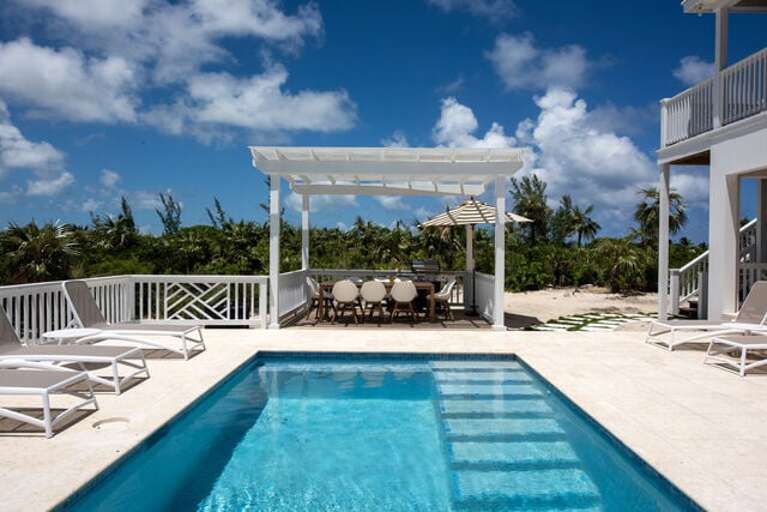 Large heated pool with covered dining option. Large heated pool with covered dining option.