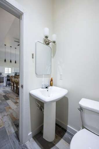 Upstairs powder room. Upstairs powder room.