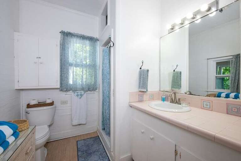 Bath with walk-in shower.