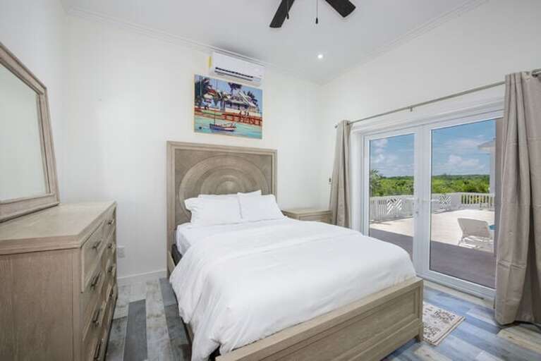 Bedroom Four with queen bed, shares a jack-and-jill full bath.
