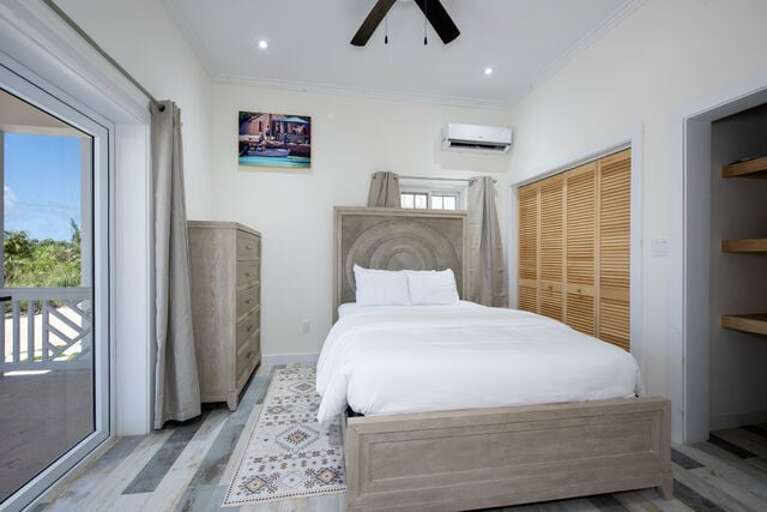 Bedroom Three with queen bed, shares a jack-and-jill full bath.