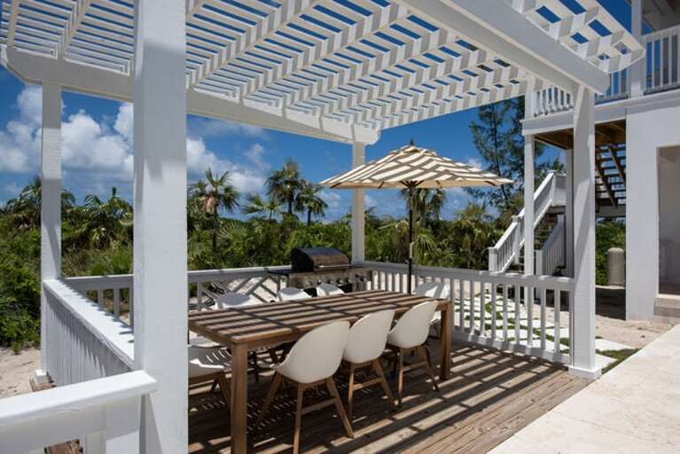 Large heated pool with covered dining option.