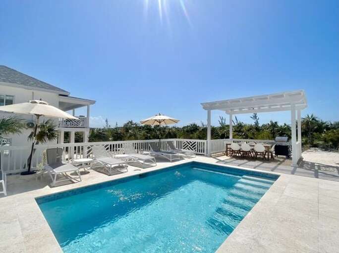 Large heated pool with covered dining option.  The Simple Life cottage is at left in this photo.  The Main House is just to the right, out of the picture.