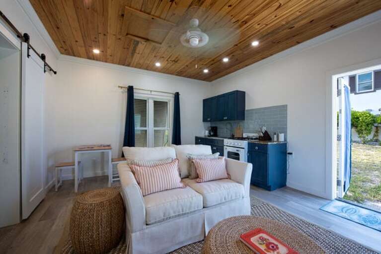 The detached guest cottage with the fourth bedroom is a complete one-bedroom house.