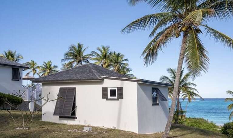 The guest cottage with the fourth bedroom is right next to the main house.  Both are beachfront with oceanviews.