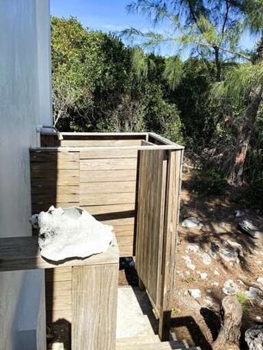 There is an outdoor shower for that island shower experience under the blue skies.