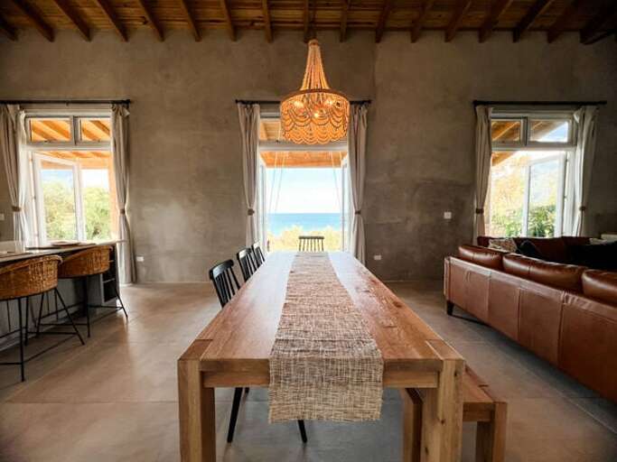 The white oak dining table seats eight to ten with a lovely ocean view.