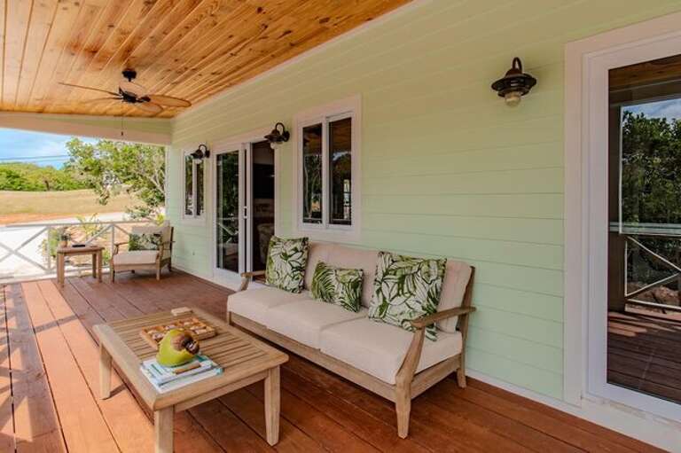 Covered porch with seating.