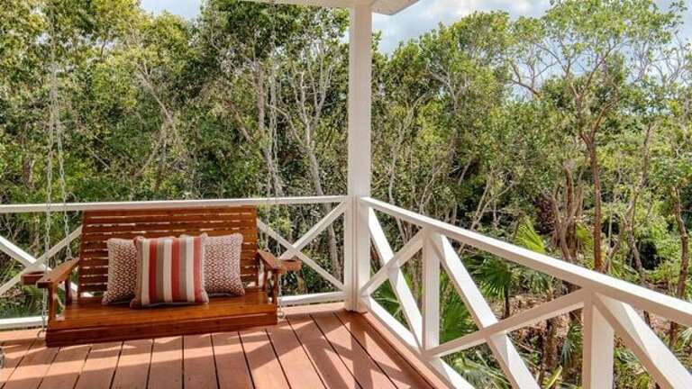 Enjoy swinging on the porch swing.