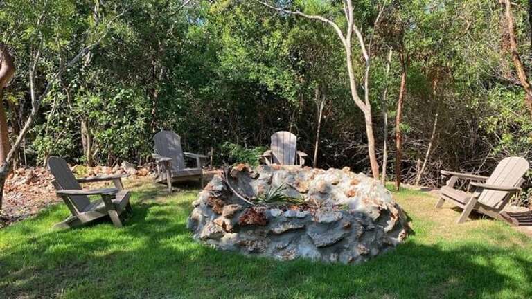 A private garden with a fire pit.