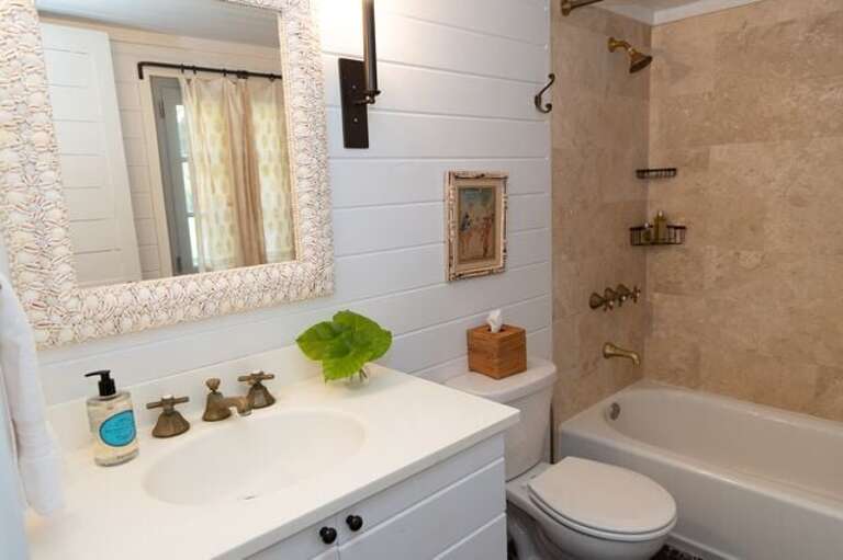 Bath with shower/tub combo.