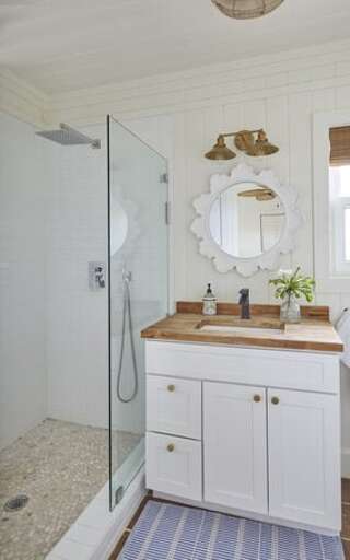 Bath with walk-in shower.