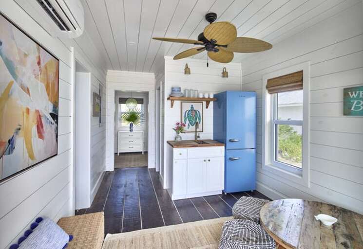 The Bunkhouse features one bedroom, two bathrooms, a kitchenette, and a covered veranda.