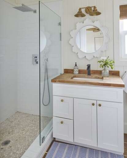 Bath with walk-in shower.