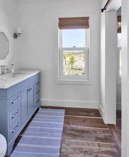 Bath with walk-in shower.