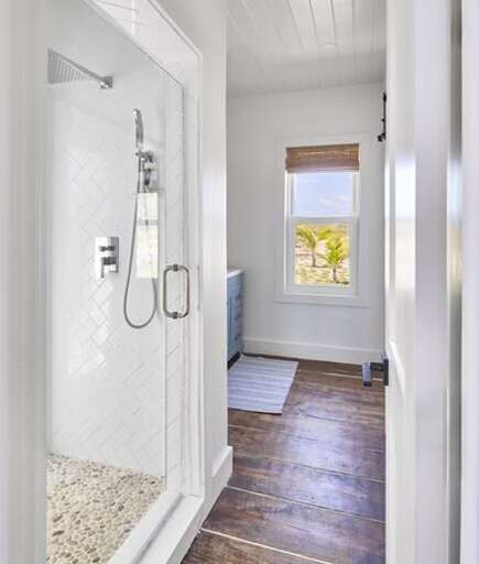 Bath with walk-in shower.