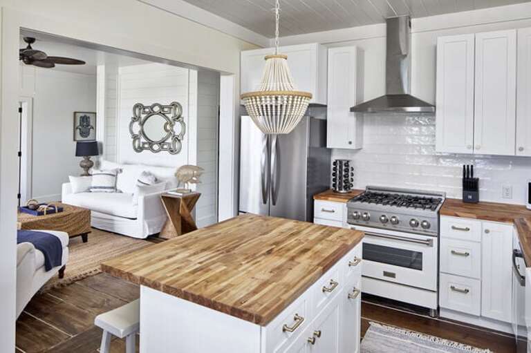 Fully equipped kitchen with island seating for two.