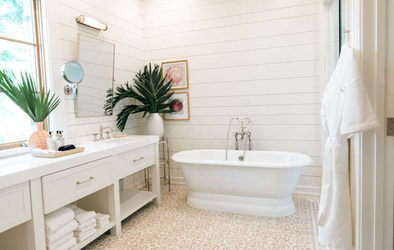 Luxurious bath with tub and walk-in shower.