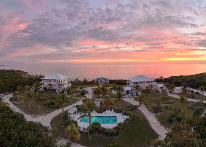 Buttonwood at sunset showing the pool, both condominium buildings, and the Main Lodge,