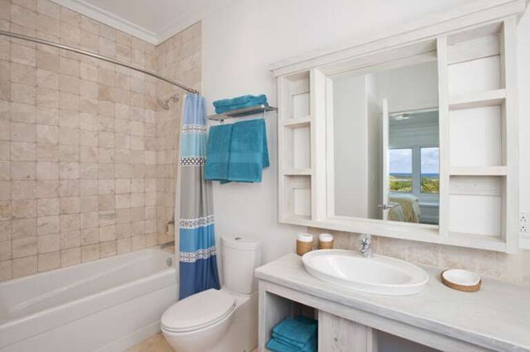 Typical guest bedroom en-suite bath will shower/tub combination.